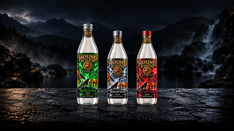 Hound of Ulster Still, Sparkling and Black Cherry Sparkling water on wet rock by a mountain waterfall at night